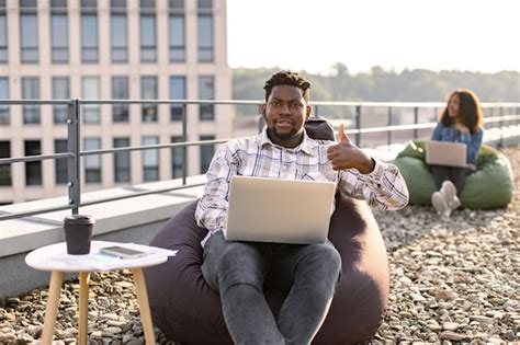 Premium Photo African American Male Freelancer Using Portable Computer