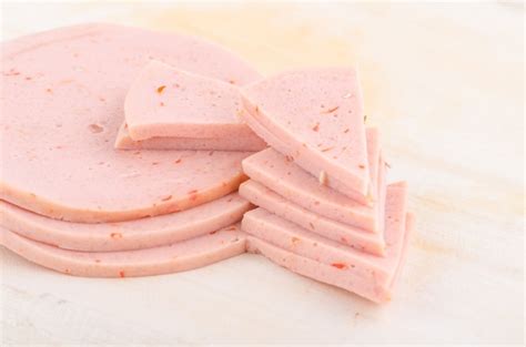 Premium Photo | Baloney sausage slices isolated on white