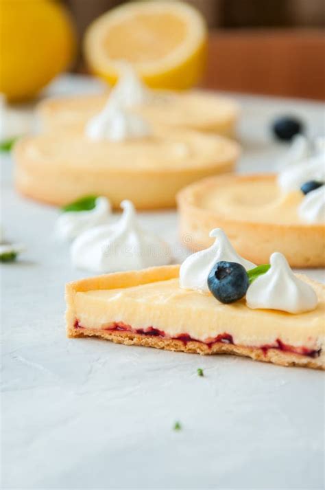 Cut Of Lemon Curd And Blueberry Jam Tarts Stock Photo Image Of Blue