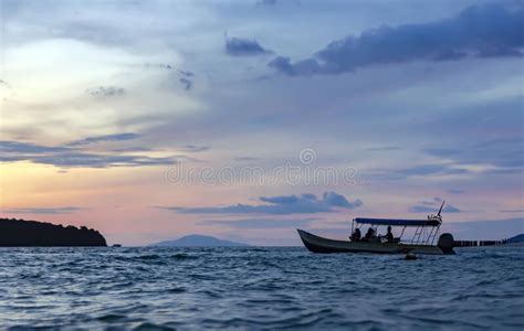 Colorful Sunset Sky With Silhouette Of Boat In Langkawi Island Stock