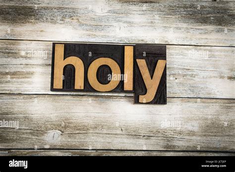 The Word Holy Written In Wooden Letterpress Type On A White Washed