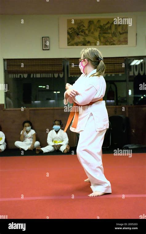 This action photo is of my daughter in her Karate class. Karate is a ...