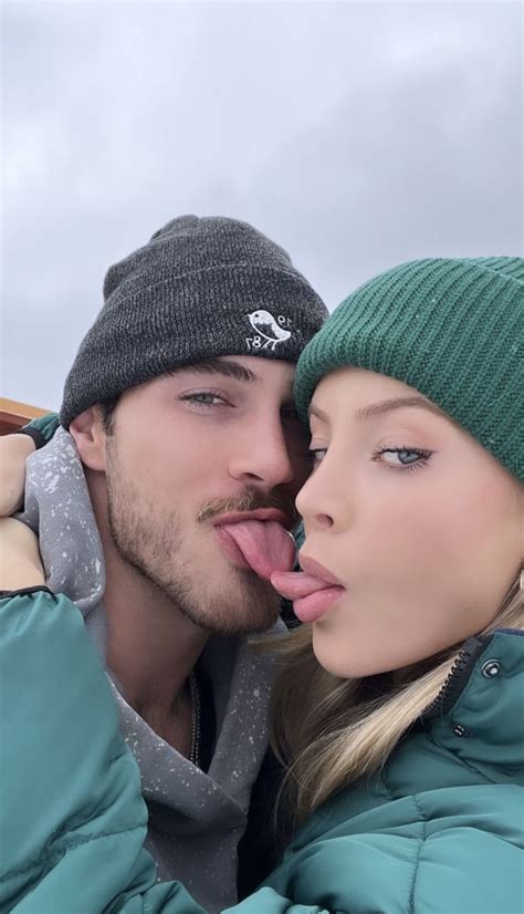 A Man And Woman With Their Tongue Hanging Out To Each Other S Faces