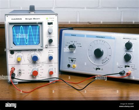 signal generator feeding a sine wave to an oscilloscope Stock Photo - Alamy