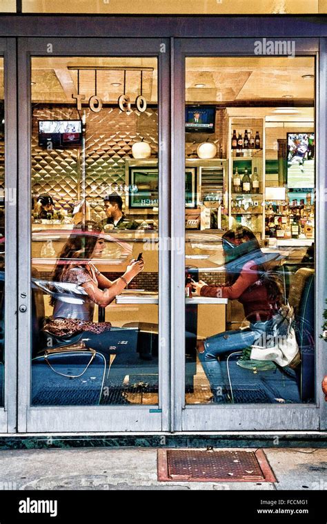 Diner dining eating inside many outside people reflections hi-res stock ...