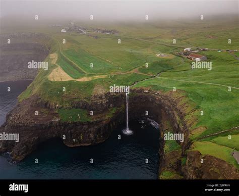 Beautiful Aerial View Of Gasadalur Waterfall And Village And Landscapes