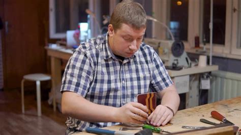 Master Of Creating Handmade Leather Wallets Beats A Hammer On The Tool