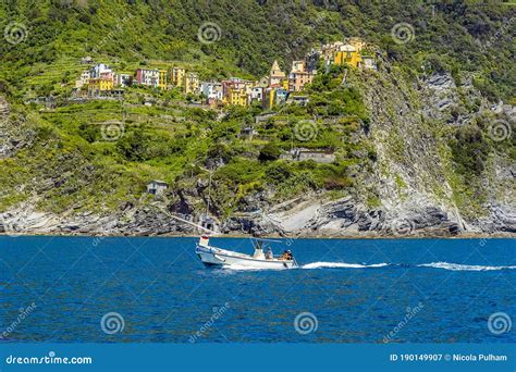 Boats Speed Past The Cinque Terre Village Of Corniglia Italy Editorial