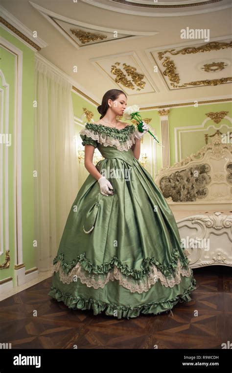 Portrait Of Retro Baroque Fashion Woman Wearing Green Vintage Dress At