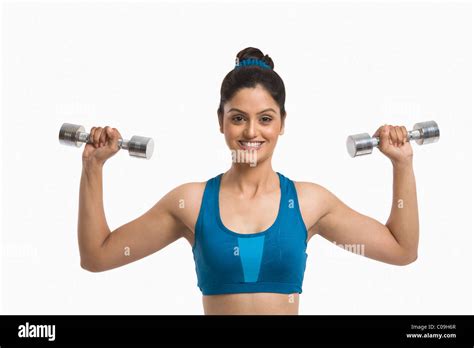 Woman Exercising With Dumbbells Stock Photo Alamy