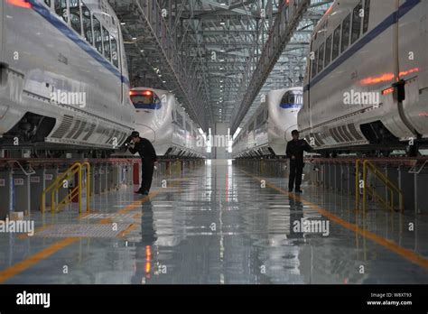 Chinese Technicians Examine Crh China Railway High Speed Bullet