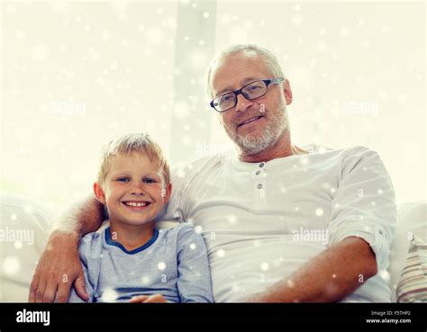 Smiling Grandfather And Grandson At Home Stock Photo Alamy