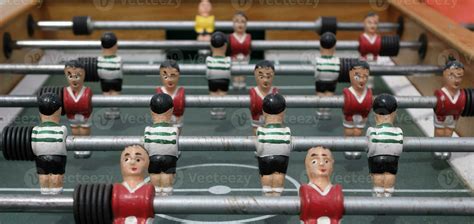 Figurines on a vintage foosball table 25417739 Stock Photo at Vecteezy