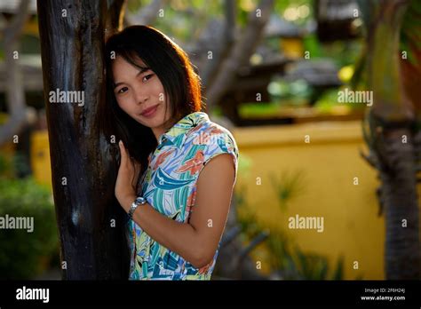 The Beautiful Thai Woman Is Poses In A Garden At The Hua Hin Resort