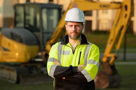 Builder At Building Site Construction Manager In Helmet Male