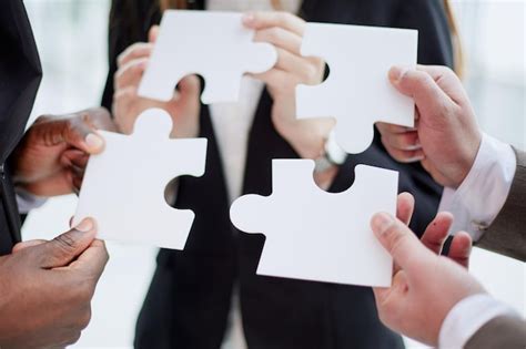 Premium Photo Group Of Business People Assembling Jigsaw Puzzle And