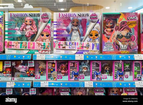 OMG and LOL dolls on shelves of toy store. LOL Surprise series toys manufactured by MGA ...