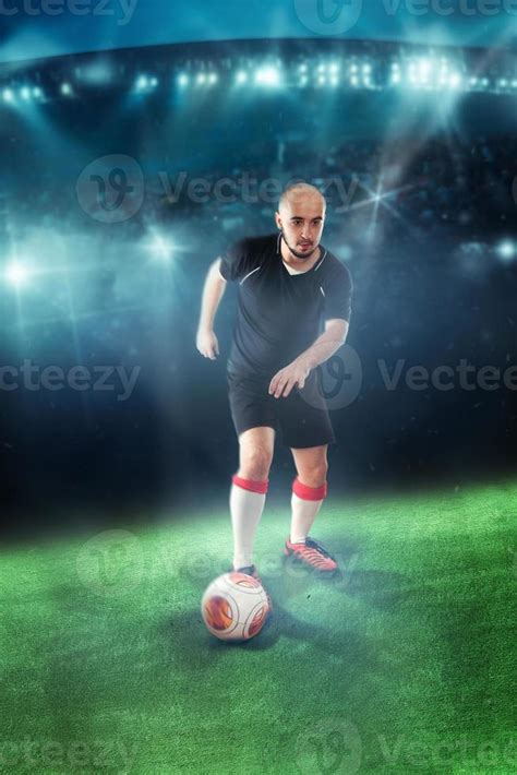 Soccer player shooting ball in the game 16518654 Stock Photo at Vecteezy