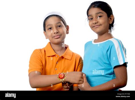 indian boy  girl brother  sister celebrating raksha bandhan rakhi