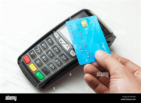 Pos Terminal Payment Machine With Credit Card On White Background