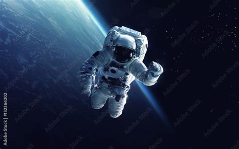 Astronaut at spacewalk. Cosmic art, science fiction wallpaper. Beauty ...