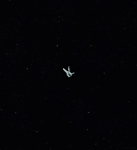 An Airplane Is Flying Through The Night Sky