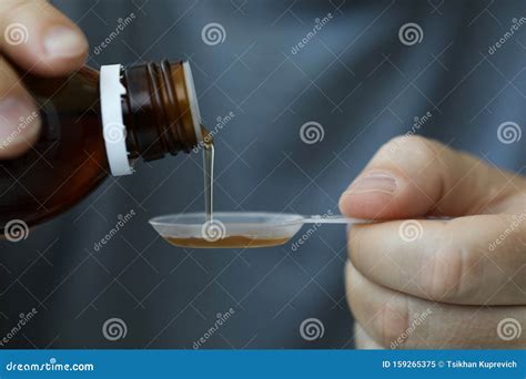 Guy Measures Desired Dosage of Medicine Stock Image - Image of ...