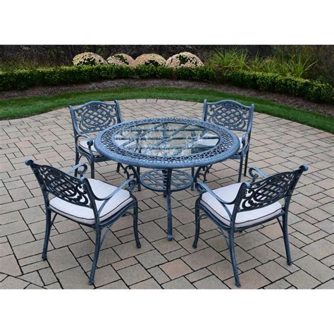 Cambridge Seasons 5 Piece Aluminum Outdoor Dining Set With Round Dining Table And Tan Cushions