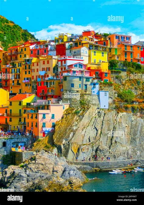 Colorful Traditional Houses On A Rock Over Mediterranean Sea Manarola