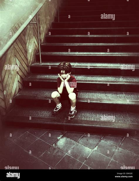 Sad Lonely Child On Stairs Hi Res Stock Photography And Images Alamy