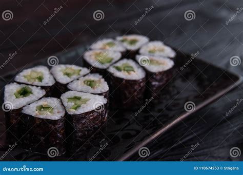 Flower From Rolls Maki Sushi On A Black Stone Plate Fresh Made Sushi