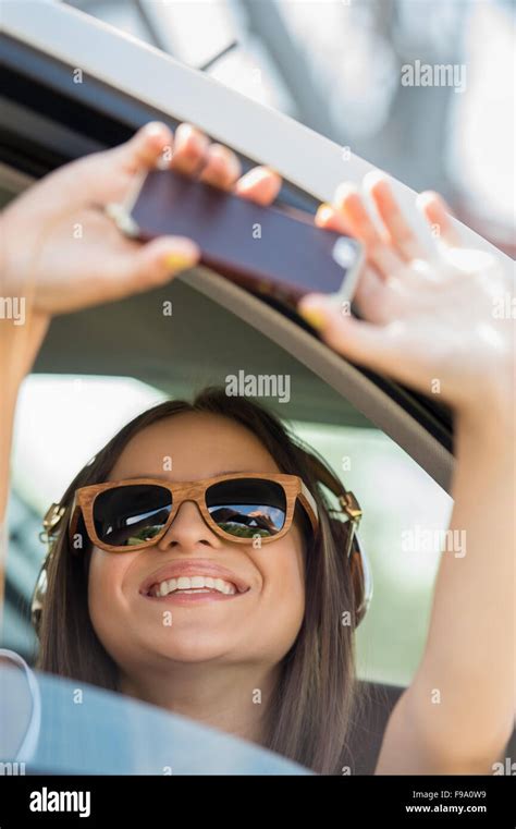 Holidays And Tourism Concept Smiling Teenage Girl Taking Selfie