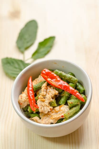 Premium Photo Spicy Stir Fried Pork With Red Curry Paste And Yard