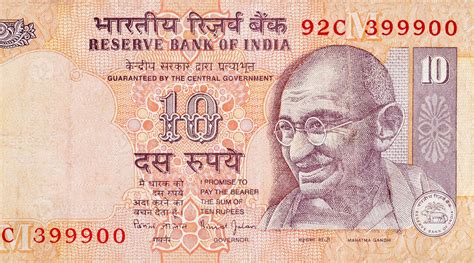 Mahatma Gandhi face on Indian bank note ten rupees. 10 Rupee National currency of India 13423683 ...