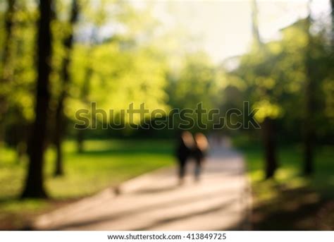 Blurring Background Couple Walking Green Park Stock Photo 413849725