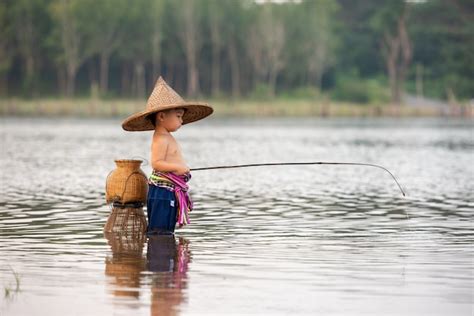 Premium Photo | Fishing boy fishing in the river.little boy fishing in ...