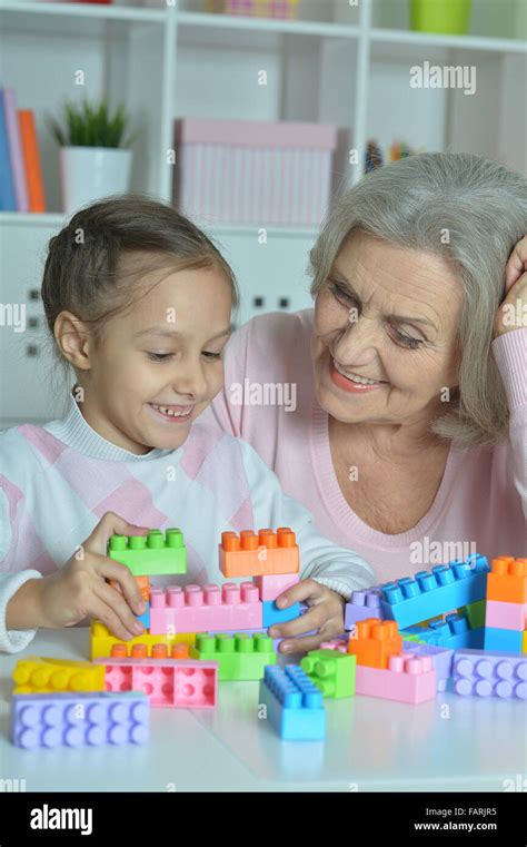 Grandmother With Granddaughter Playing Together Stock Photo Alamy