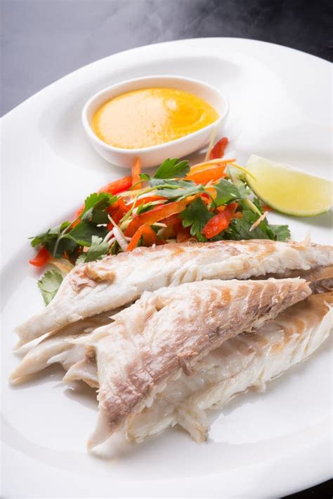 Baked White Fish Fillet Served with Steamed Rice Stock Photo - Image of ...