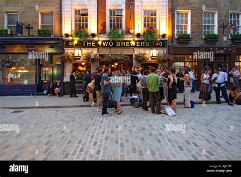 Patrons Drinking Outside The Two Brewers Pub In Covent Garden In London