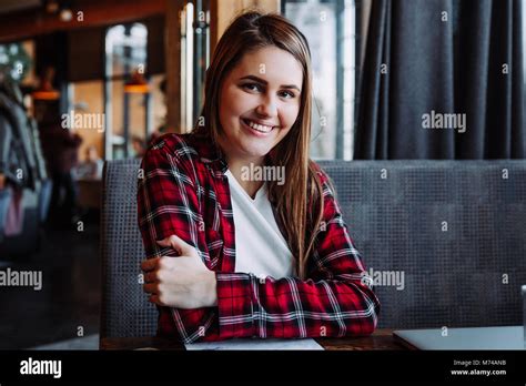 Beautiful Brunette Smiling At Camera Sitting In Cafe Stock Photo Alamy