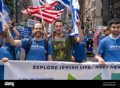 Participants Holding Israeli Flags March Along Fifth Avenue During The