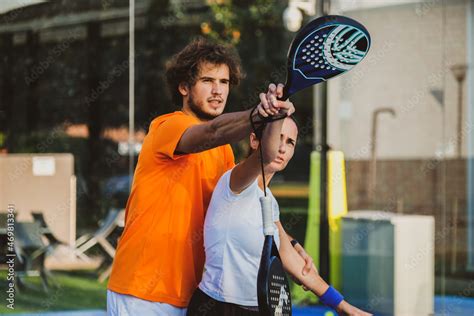 Young Teacher Is Monitoring Teaching Padel Lesson To His Student