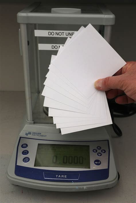 Weighing Paper On A Scale