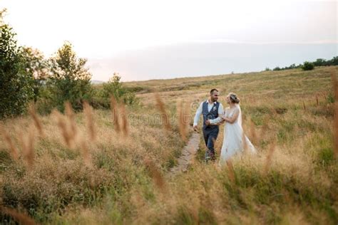 Bride Blonde Girl And Groom In A Field Stock Photo Image Of Summer Bouquet 269517380