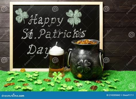 Happy St Patricks Day Chalk Lettering On Blackboard Mug Of Beer