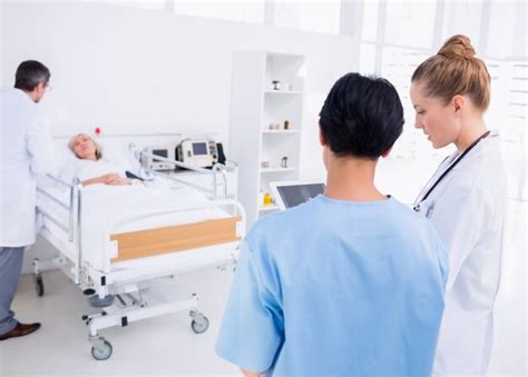 Premium Photo Doctors Visiting A Patient In Hospital