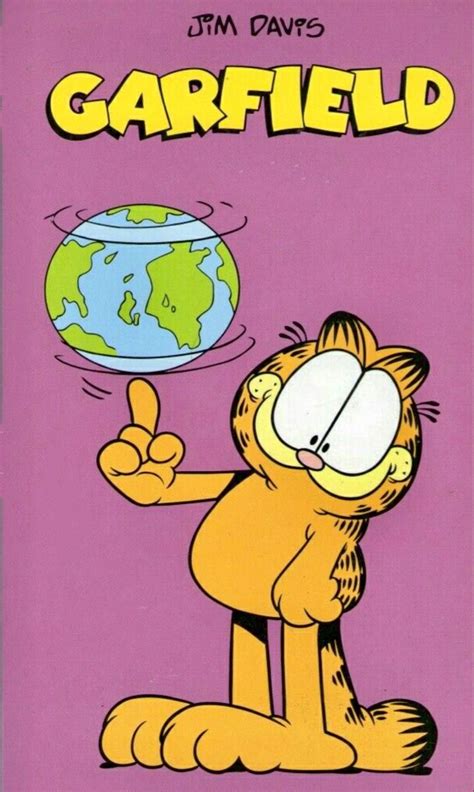 Garfield The Cat Is Holding A Globe In His Hand And Pointing To It S Left