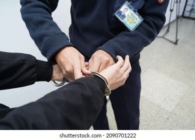 Police Officer Handcuffs Suspect Stock Photo 2090701222 | Shutterstock