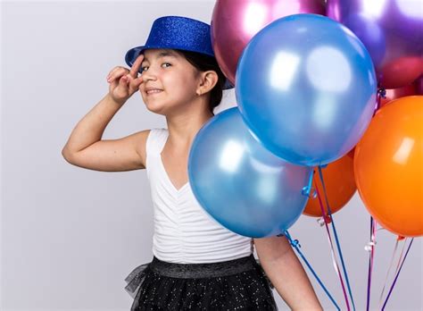 Souriante Jeune Fille Caucasienne Avec Chapeau De F Te Bleu Tenant Des