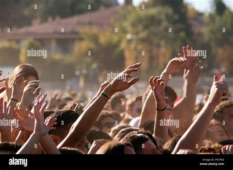 Crowded people hands up at a day time concert Stock Photo - Alamy